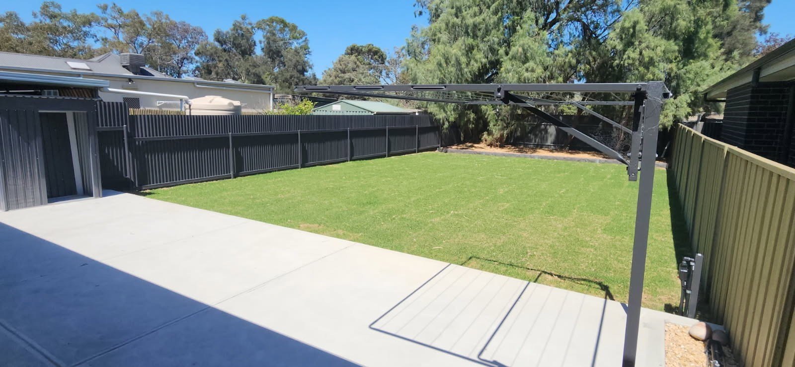 Landscaped Adelaide backyard with new lawn and concrete paths