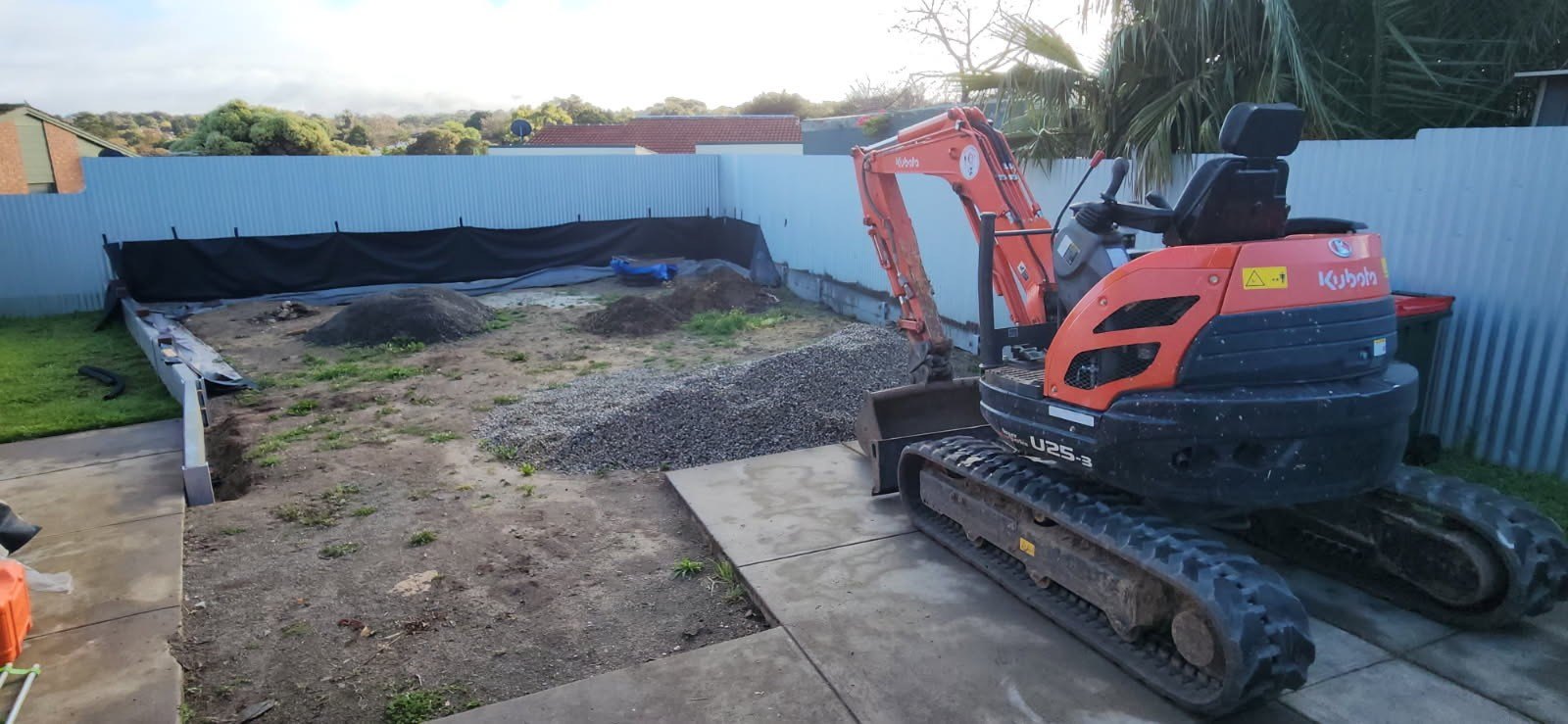 Mini excavator working on residential earthworks in Adelaide
